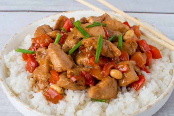 istock kung pao chicken with chopsticks 1369391211