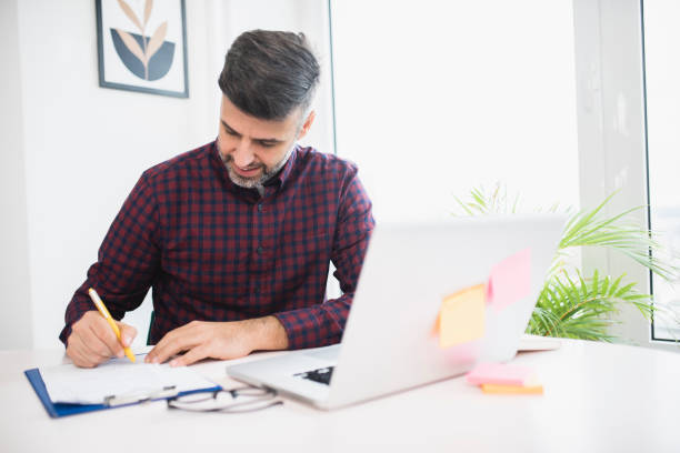 istock Businessman planning business at his office 1369391375