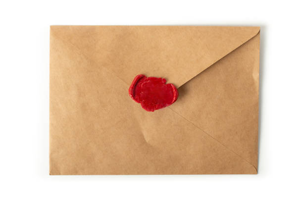 istock Envelope with brown wax seal on a white background 1369392818