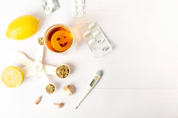 istock cough medicine. tea and home treatment 1369392953