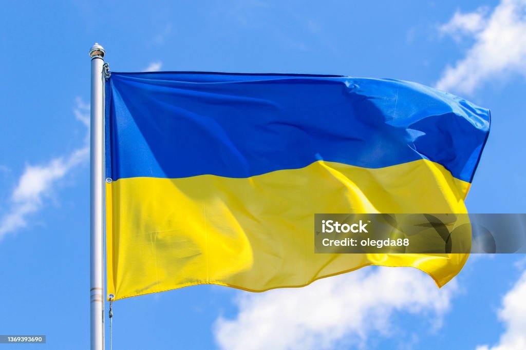 Flag of Ukraine Flag of Ukraine on a background of blue sky Ukrainian Flag Stock Photo