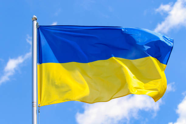 Flag of Ukraine Flag of Ukraine on a background of blue sky ukrainian language stock pictures, royalty-free photos & images