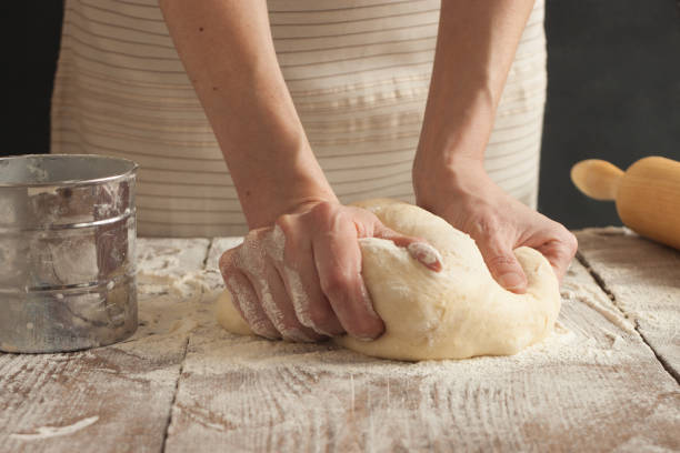 istock A woman kneads the dough 1369393855