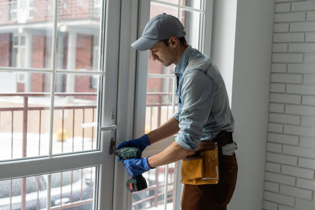 istock handyman adjusting white pvc plastic window indoors. worker using screwdriver to repair upvc window. homework maintenance. 1369393889