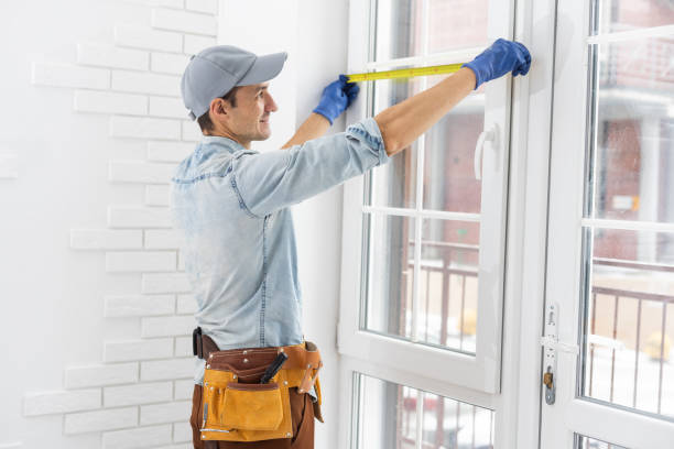 istock The worker installing and checking window in the house 1369393905