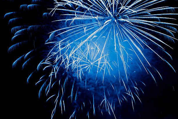 blue fireworks explosion stock photo