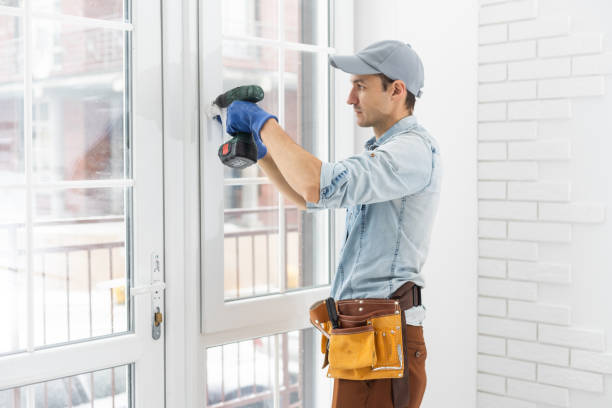 istock handyman adjusting white pvc plastic window indoors. worker using screwdriver to repair upvc window. homework maintenance. 1369395707