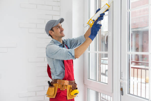 istock The worker installing and checking window in the house 1369396536