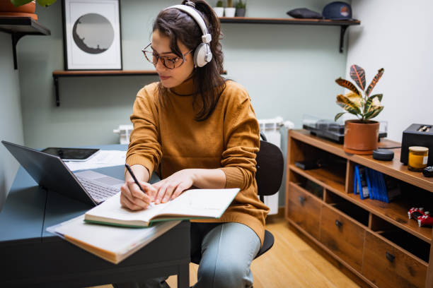 istock Young woman working in her home office 1369396648