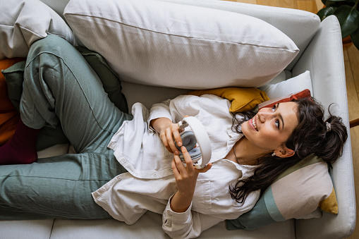 Portrait of a young woman relaxing on the couch