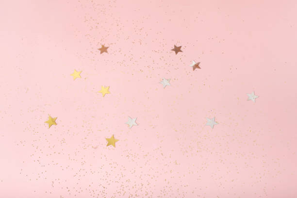istock Golden sparkles on pink pastel trendy background. Festive backdrop for your projects. 1369398593