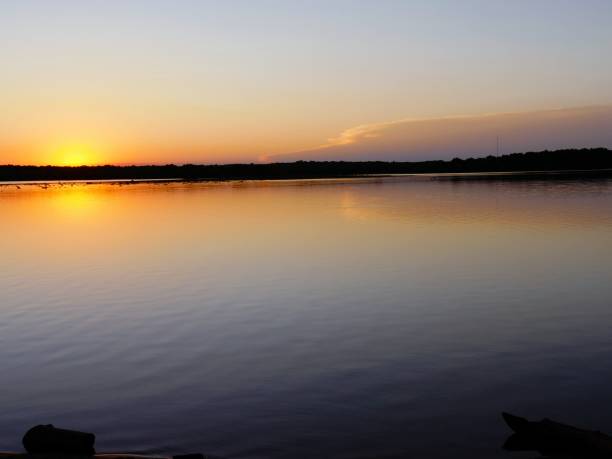 istock Sunset reflected in the lake, wide shot 1369401251
