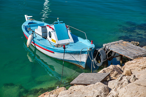 Fishing boat closeup in seaport. Ayia Napa is a tourist resort at the far eastern end of the southern coast of Cyprus.