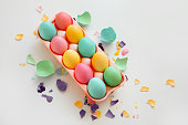 Painted colorful eggs on a tray for Easter day.