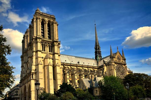 istock Cathedral of Notre-Dame in Paris feather clouds blue sky side view 1369405613