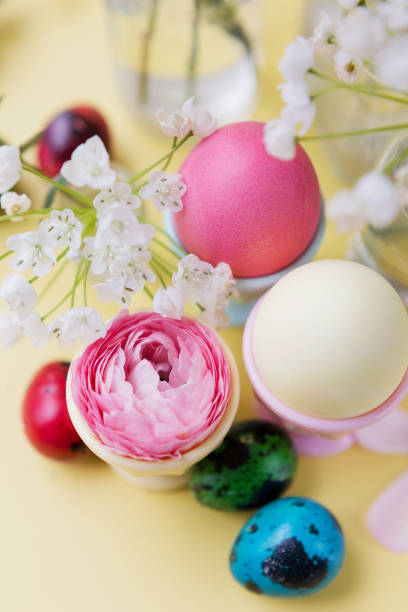 istock Easter eggs, flowers on yellow background 1369407001