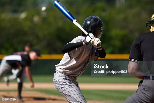 View Of Baseball Batter From Behind The Catcher As They Hit Stock Photo - Download Image Now