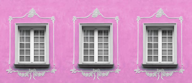 istock Beautiful white window and pink plastered wall 1369408468