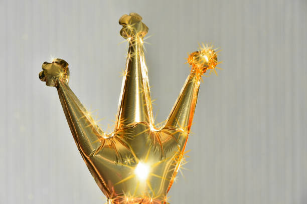 istock Golden crown balloon with sparkles and highlights. 1369410782