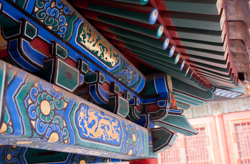 Decorative multicolor painted wooden awning at an Oriental palace.