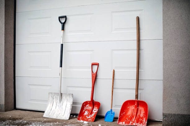 Shovel standing in front of home garage door