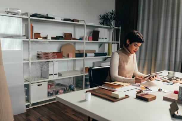 istock Hard-working Jewelry Designer Doing Research for her Project Using a Tablet 1369414806