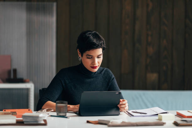 istock Beautiful Female Architect Working Hard on a Project 1369414816