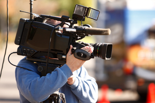 A news cameraman with his camera.