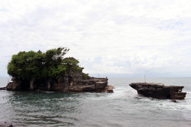 Tanah Lot Temple in Bali Indonesia in the middle of the sea. Taken January 2022. stock photo