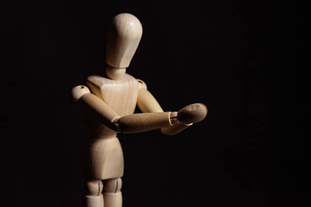 istock Wooden mannequin praying 1369419373