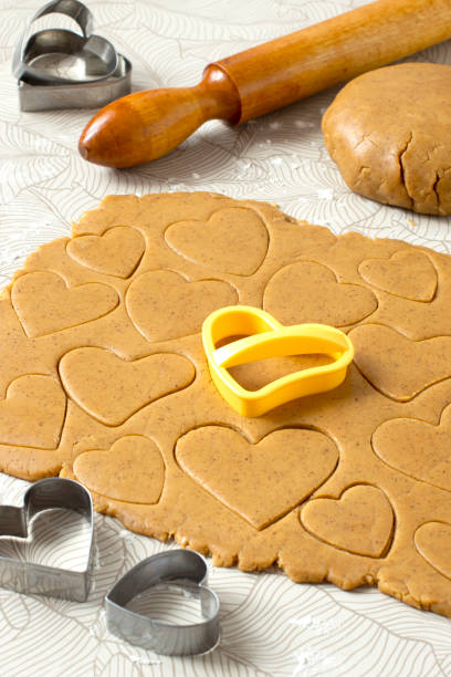 istock Making heart-shaped gingerbread for Valentine's Day 1369420427