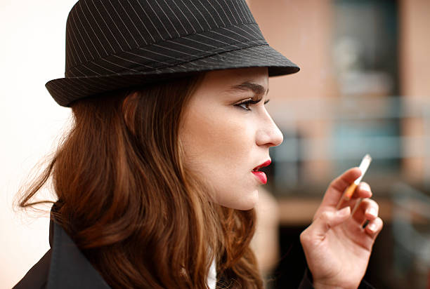 istock Young woman smoking 136942080