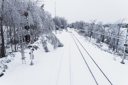 Railway line and signal during an intense ice storm.