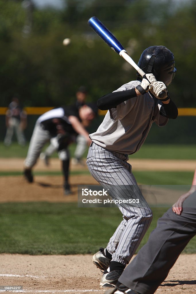 Batter up A batter about to hit a pitch during a baseball game. Baseball - Ball Stock Photo