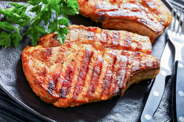 istock grilled bone-in pork chops on a black plate 1369425799