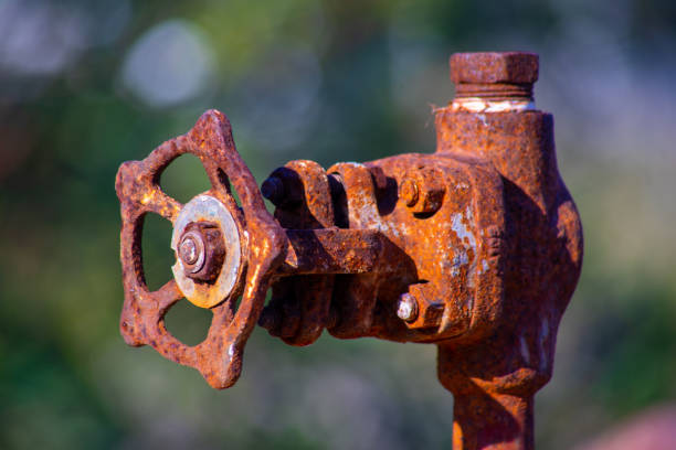istock old and rusty industrial liquid control faucet. 1369430453