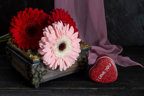 istock Festive gerbera on wooden table close-up 1369430471