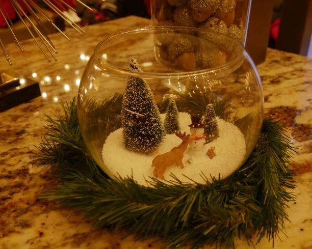 istock Small glass with Christmas trees, deer and a snowman decoration 1369431461