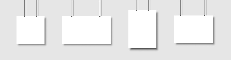 Template of white blank vector posters. Set of mockups hanging on the wall. Frame for paper sheet. Isolated on gray background. Vector illustration EPS 10.