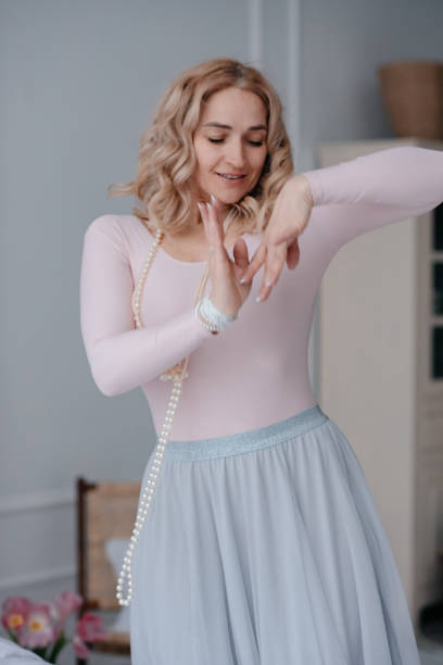 istock The girl dances with long beads around her neck. 1369435564