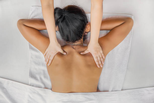 Asian Woman Getting a Back Massage stock photo