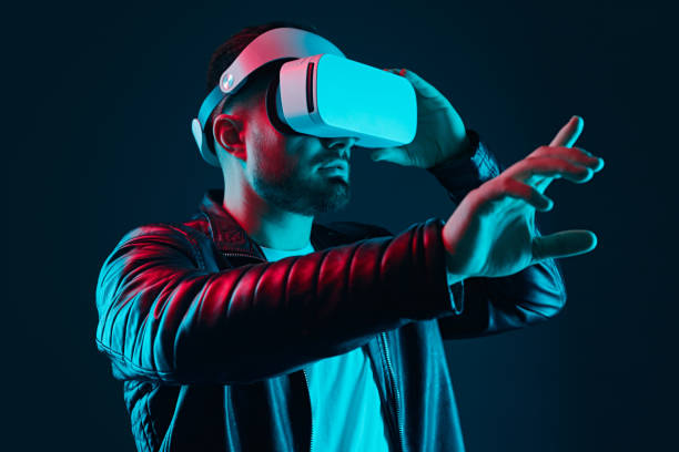 istock Man in VR headset touching air 1369437915