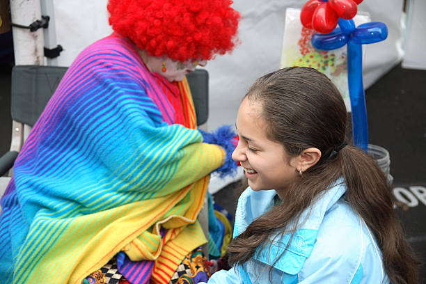 istock Young girl with clown 136943879