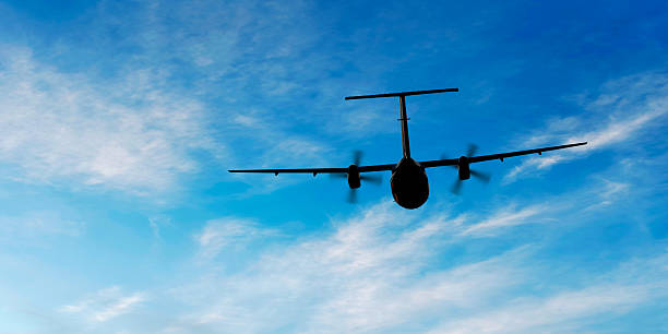 istock propeller airplane flying in bright sky 136945003