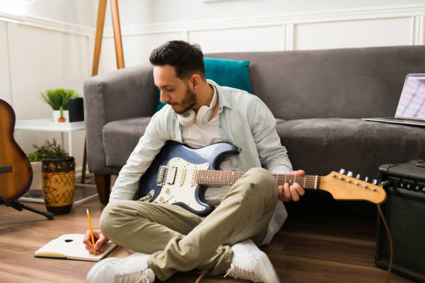 istock Male composer working on a song 1369459378