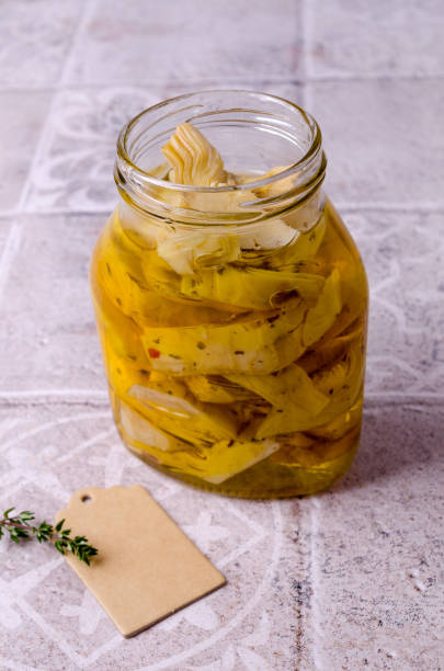 istock Canned slices of fried artichokes 1369461022