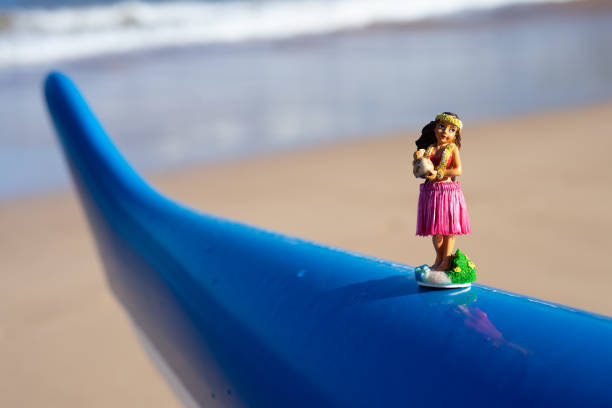 istock Hula Doll Sits on Outrigger Canoe in Hawaii 1369464866