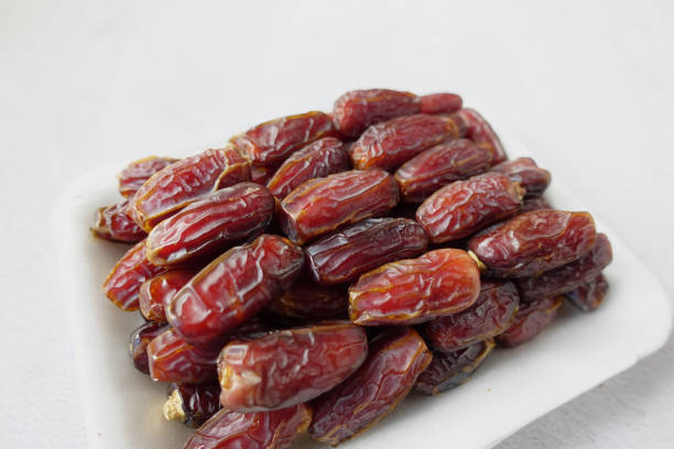 istock close up of fresh date fruit in a bowl on table 1369465164