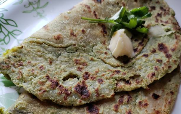 istock Aloo Matar Paratha or  Indian Potato stuffed Flatbread. 1369466529