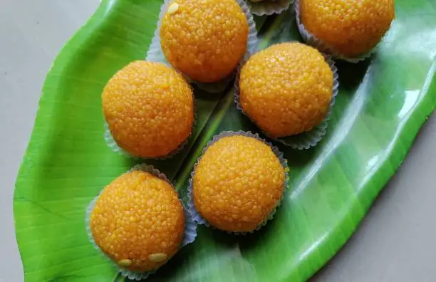 Photo of Motichoor laddoo also know as bundi laddu, Indian dessert, made of gram flour very small balls or boondis which are deep fried.